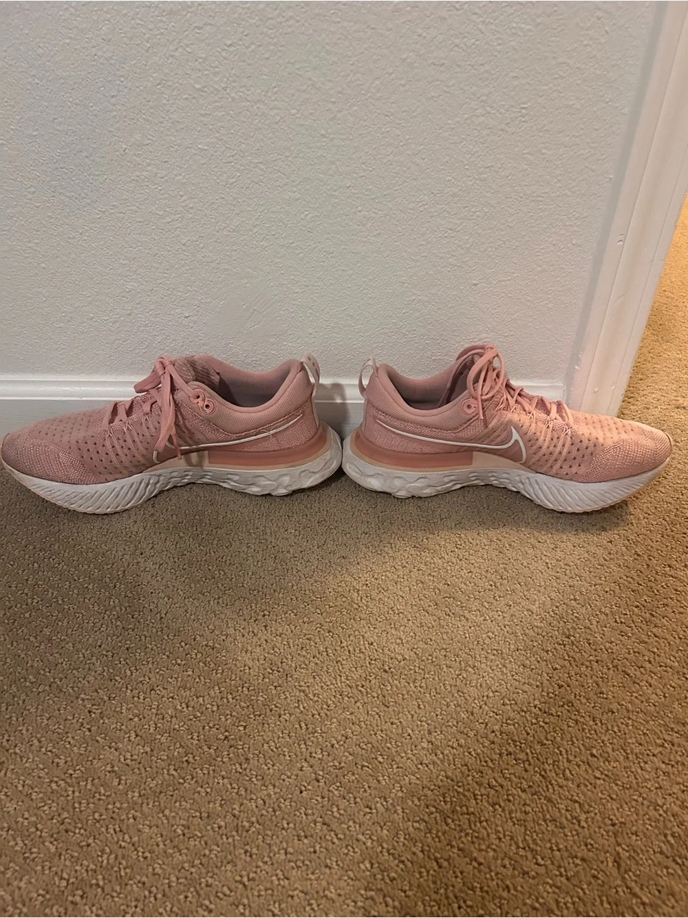 Nike Women's React Infinity Run Flyknit 2 Running Shoes in Pink Glaze